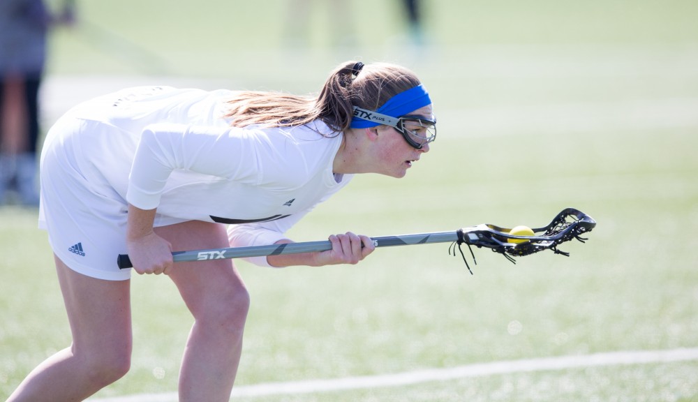 GVL / Kevin Sielaff – Meghan Datema (18) prepares to take a shot on McKendree's net. The Lakers defeat the Bearcats of McKendree University with a final score of 23-11 Friday, March 25, 2016 in Allendale.