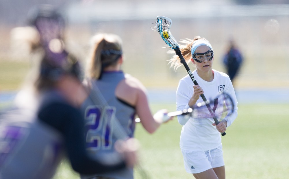 GVL / Kevin Sielaff – Ryan Skomial (1) looks to pass the ball as she moves in Mckendree's zone. The Lakers defeat the Bearcats of McKendree University with a final score of 23-11 Friday, March 25, 2016 in Allendale.