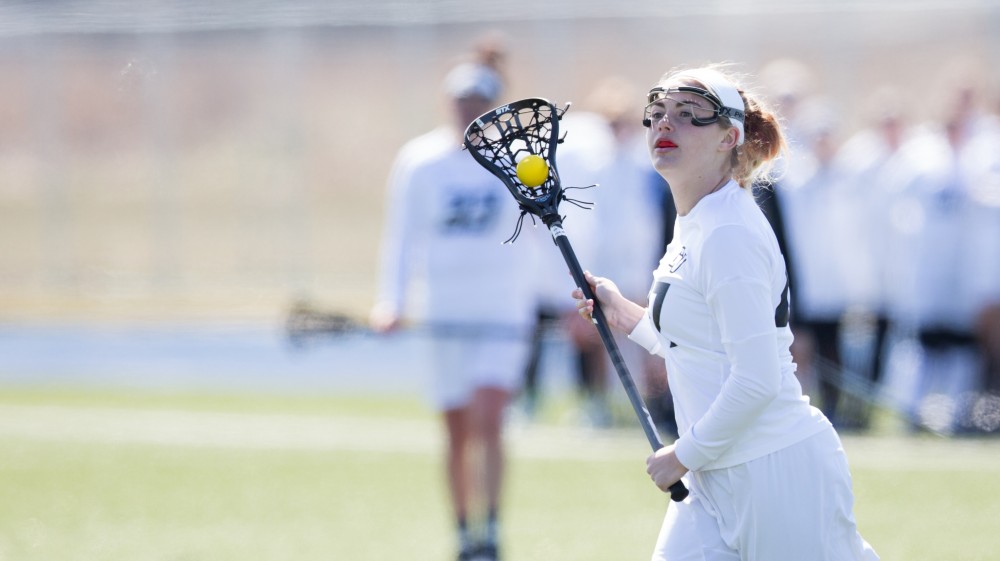 GVL / Kevin Sielaff – Danielle Tunnell (27) moves the ball in front of McKendree's net. The Lakers defeat the Bearcats of McKendree University with a final score of 23-11 Friday, March 25, 2016 in Allendale.