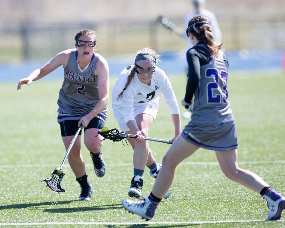 GVL / Kevin Sielaff – Erika Neumen (3) picks up a loose ball. The Lakers defeat the Bearcats of McKendree University with a final score of 23-11 Friday, March 25, 2016 in Allendale.