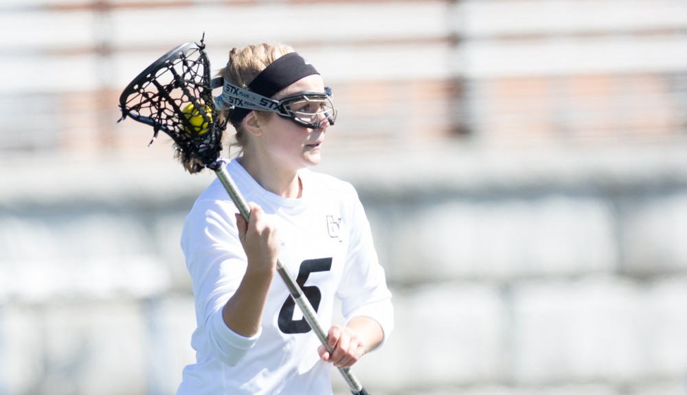 GVL / Kevin Sielaff – Ashley Bailey (6) looks to pass the ball up field. The Lakers defeat the Bearcats of McKendree University with a final score of 23-11 Friday, March 25, 2016 in Allendale.