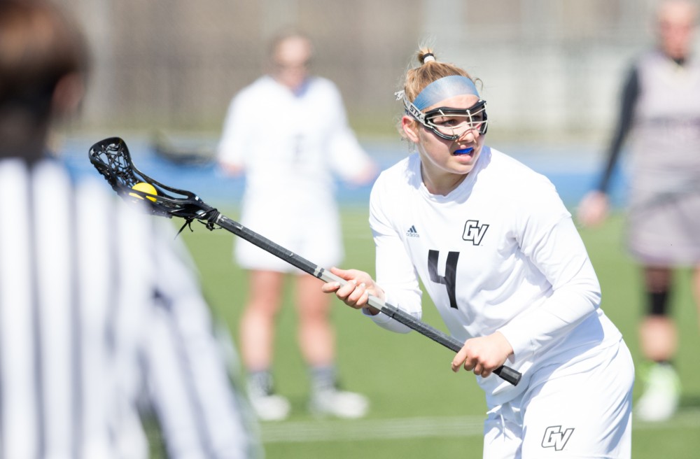 GVL / Kevin Sielaff – Kira Dosenberry (4) looks to pass the ball. The Lakers defeat the Bearcats of McKendree University with a final score of 23-11 Friday, March 25, 2016 in Allendale.