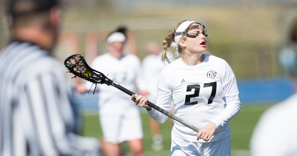 GVL / Kevin Sielaff – Danielle Tunnell (27) holds the ball and looks to pass. The Lakers defeat the Bearcats of McKendree University with a final score of 23-11 Friday, March 25, 2016 in Allendale.