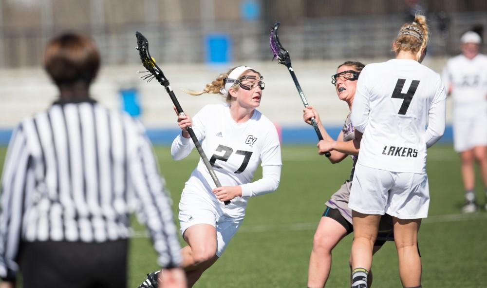 GVL / Kevin Sielaff – Danielle Tunnell (27) moves in for a shot on net. The Lakers defeat the Bearcats of McKendree University with a final score of 23-11 Friday, March 25, 2016 in Allendale.