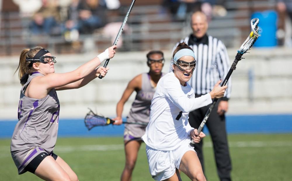 GVL / Kevin Sielaff – Ryan Skomial (1) fights her way toward McKendree's net. The Lakers defeat the Bearcats of McKendree University with a final score of 23-11 Friday, March 25, 2016 in Allendale.