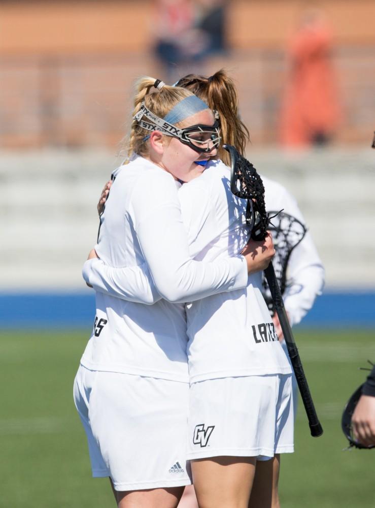 GVL / Kevin Sielaff – Kira Dosenberry (4) and Ryan Skomial (1) embrace after a goal. The Lakers defeat the Bearcats of McKendree University with a final score of 23-11 Friday, March 25, 2016 in Allendale.