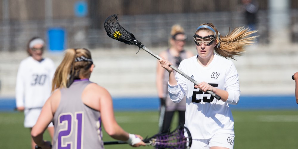 GVL / Kevin Sielaff – Carlyn Shisler (25) holds the ball near Mckendree's net. The Lakers defeat the Bearcats of McKendree University with a final score of 23-11 Friday, March 25, 2016 in Allendale.