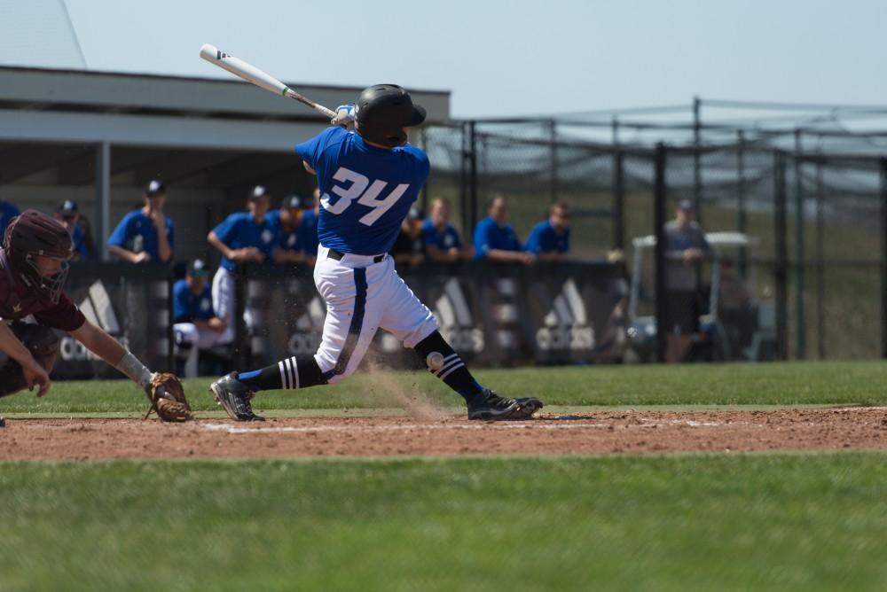 GVL / Luke Holmes - Brody Andrews grounds the ball at his feet. Grand Valley Men’s Baseball lost to Walsh college 3-4 in the first game but won 15-8 in the second game.