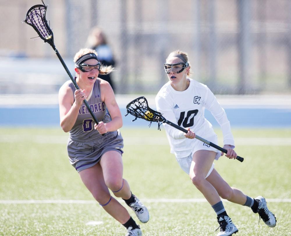 GVL / Kevin Sielaff – Chelsey Bishop (10) moves the ball in on McKendree's net and looks to pass. The Lakers defeat the Bearcats of McKendree University with a final score of 23-11 Friday, March 25, 2016 in Allendale.