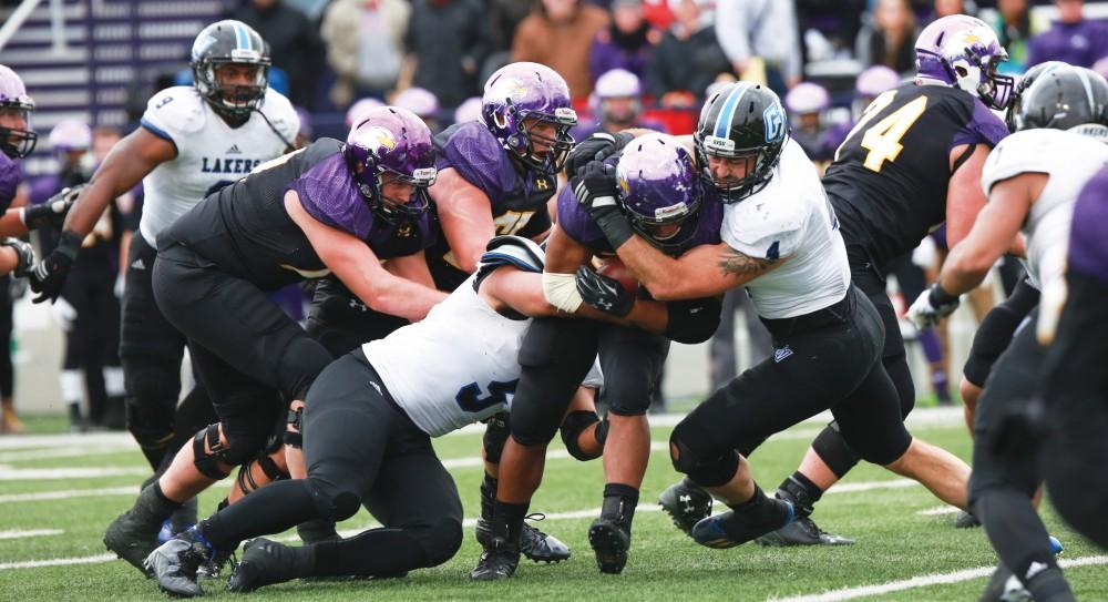 GVL / Kevin Sielaff -  Alton Voss (4) brings down an Ashland offensive attack.  Grand Valley defeats Ashland with a final score of 45-28 Nov. 22 at Ashland University.