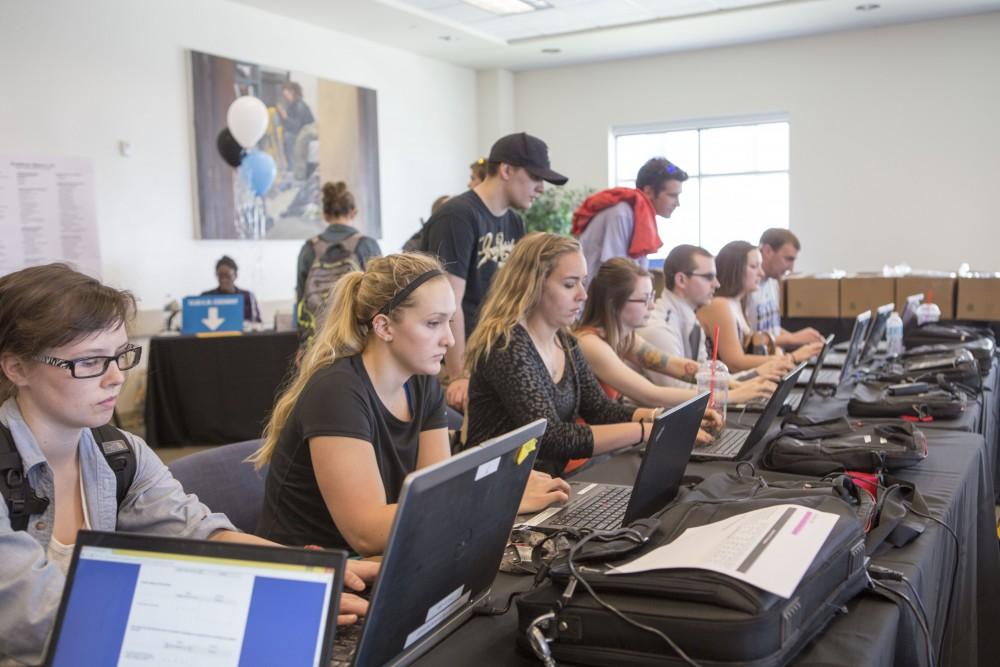 GVL / Sara Carte - Seniors fill out their last Grand Valley survey at GradFest in the Kirkhof Center on Monday, Apr. 18, 2016.