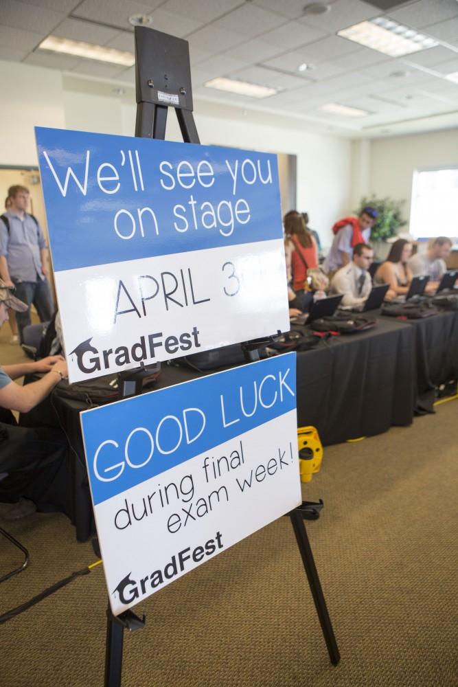 GVL / Sara Carte - Seniors attend GradFest to get their pictures taken, pick up cap and gowns, and win free prizes in the Kirkhof Center on Monday, Apr. 18, 2016.