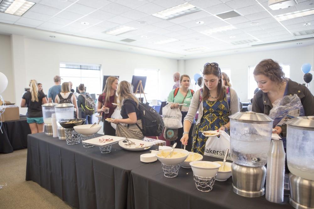 GVL / Sara Carte - Seniors eat snacks at GradFest in the Kirkhof Center on Monday, Apr. 18, 2016.