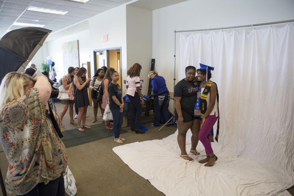 GVL / Sara Carte - Seniors get their pictures taken at GradFest in the Kirkhof Center on Monday, Apr. 18, 2016.