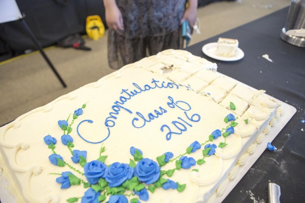 GVL / Sara Carte - Seniors recieve complementary cake at GradFest in the Kirkhof Center on Monday, Apr. 18, 2016.