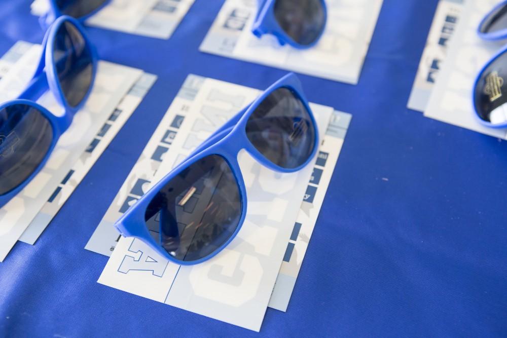 GVL / Sara Carte - Seniors recieve a pair of sunglasses and Grand Valley car decals at GradFest in the Kirkhof Center on Monday, Apr. 18, 2016.