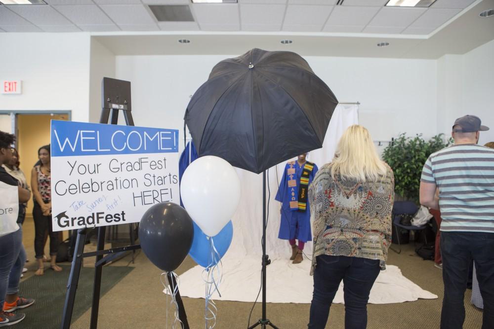 GVL / Sara Carte - Seniors get their pictures taken at GradFest in the Kirkhof Center on Monday, Apr. 18, 2016.