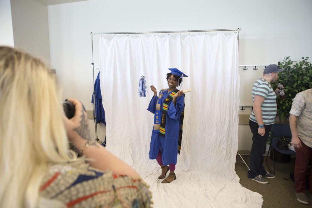 GVL / Sara Carte - Seniors get their pictures taken at GradFest in the Kirkhof Center on Monday, Apr. 18, 2016.