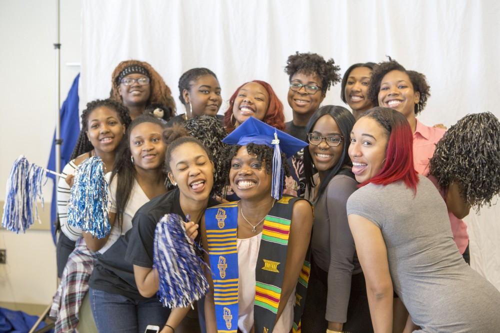 GVL / Sara Carte - Seniors get their pictures taken at GradFest in the Kirkhof Center on Monday, Apr. 18, 2016.