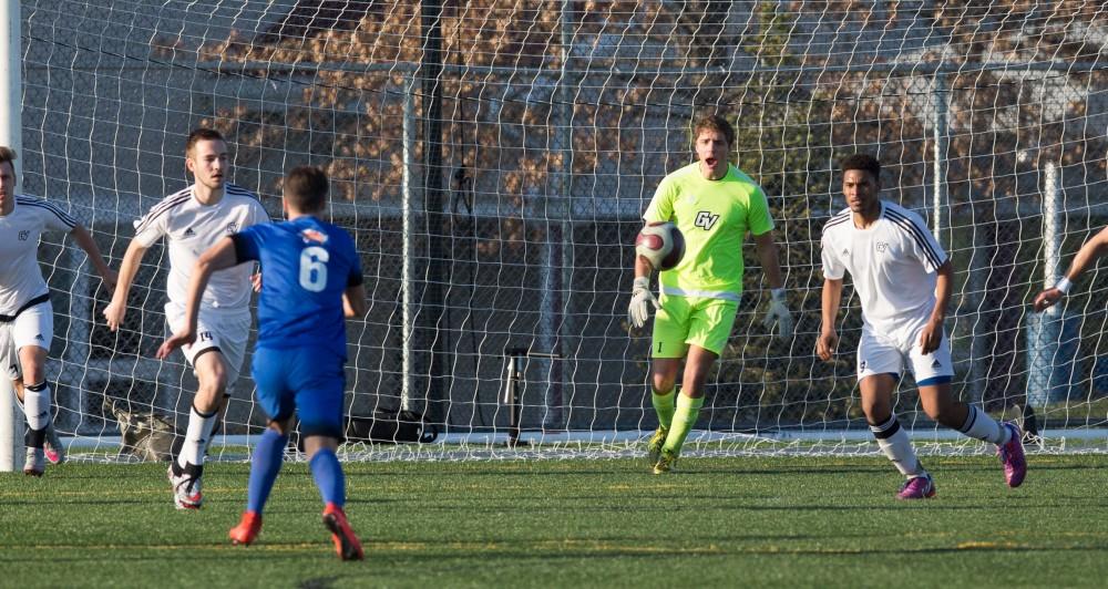 GVL / Kevin Sielaff - Goalkeeper Alex Pastor (1) calls out for the ball as GRFC sends it toward the net. Grand Valley's men's club soccer team falls to GRFC with a final score of 2-0 on Friday, April 15, 2016.