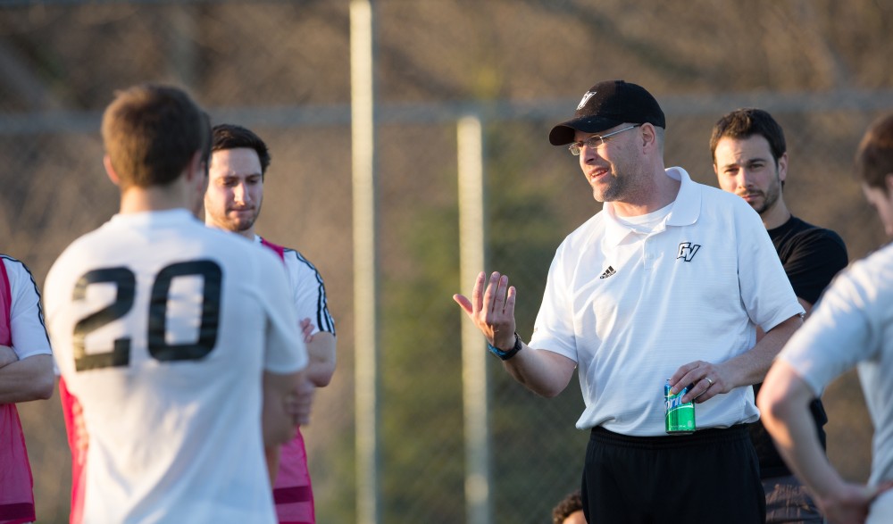 GVL / Kevin Sielaff - Head coach Jeff Crooks speaks to his men at halftime. Grand Valley's men's club soccer team falls to GRFC with a final score of 2-0 on Friday, April 15, 2016.