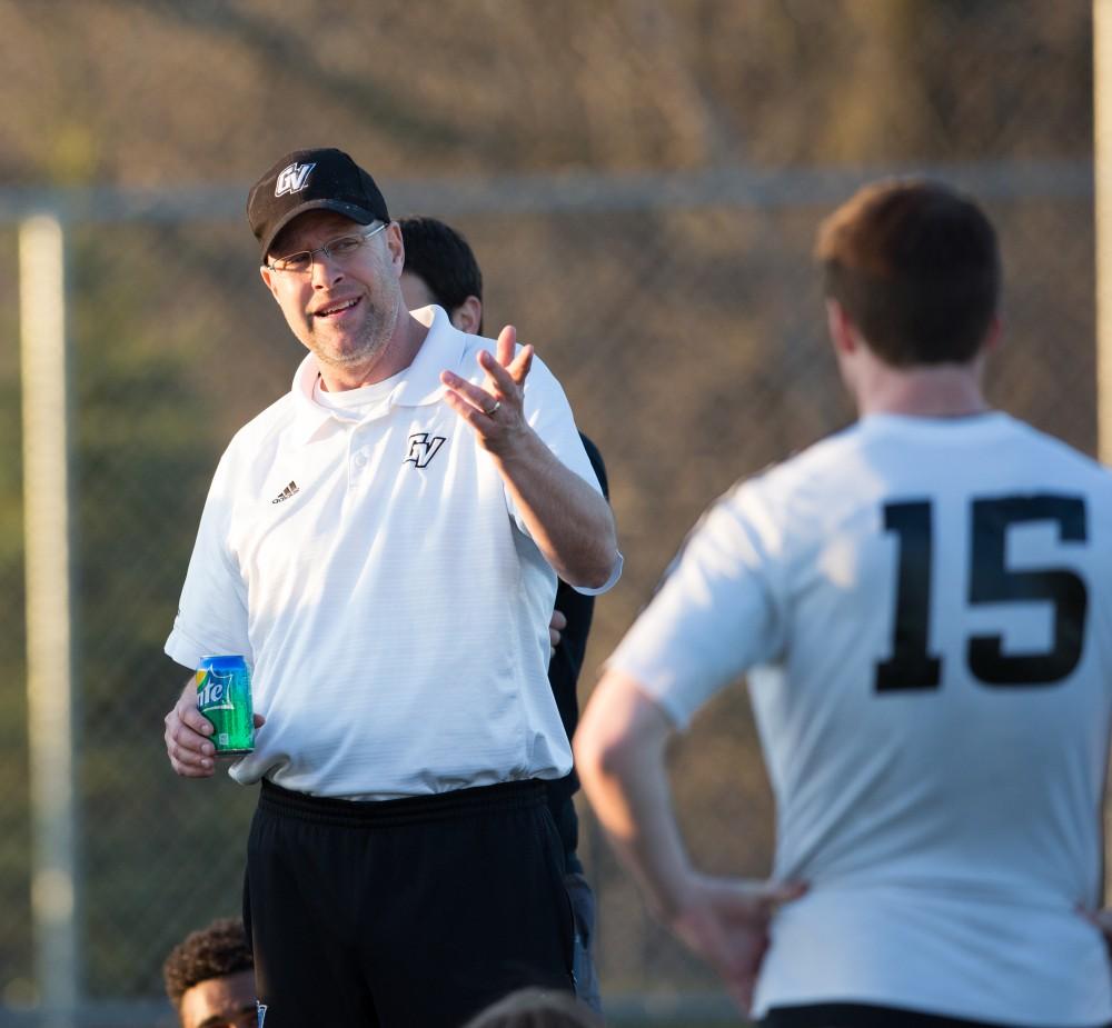 GVL / Kevin Sielaff - Head coach Jeff Crooks speaks to his men at halftime. Grand Valley's men's club soccer team falls to GRFC with a final score of 2-0 on Friday, April 15, 2016.