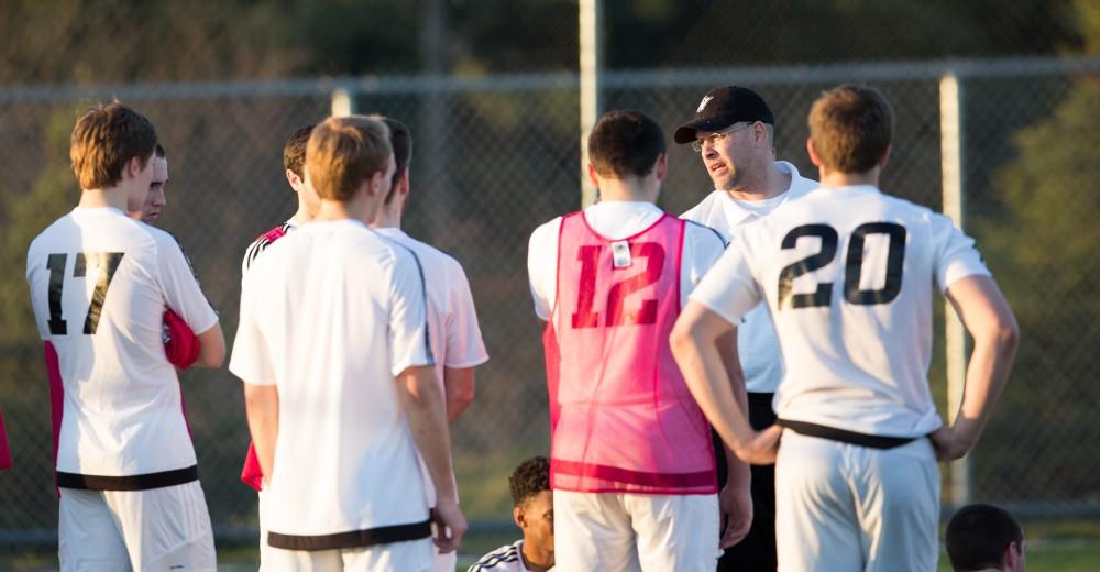 GVL / Kevin Sielaff - Head coach Jeff Crooks speaks to his men at halftime. Grand Valley's men's club soccer team falls to GRFC with a final score of 2-0 on Friday, April 15, 2016.