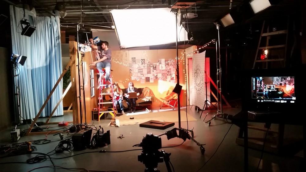GVL / Courtesy - Zach LucassianZach Lucassian (left) sets a 650 key light on the set of The Green Room inside of the Kirkhof Center studio Saturday, April 9, 2016.