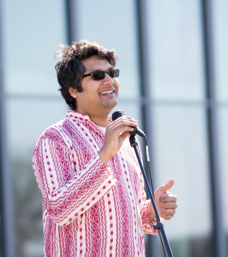 GVL / Kevin Sielaff - Assistant Professor Abhishek Ghosh speaks before the start of the celebration. Grand Valley celebrates India’s spring color festival, Holi, for the first time on Friday, April 15, 2016.