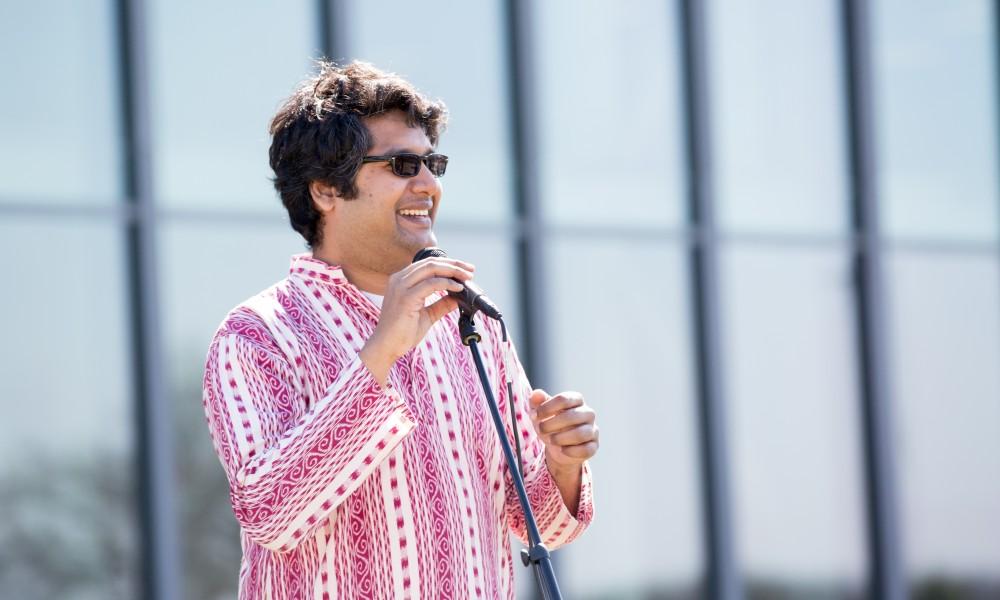 GVL / Kevin Sielaff - Assistant Professor Abhishek Ghosh speaks before the start of the celebration. Grand Valley celebrates India’s spring color festival, Holi, for the first time on Friday, April 15, 2016.