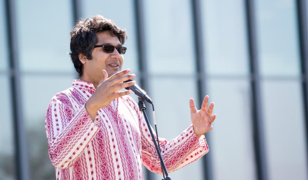 GVL / Kevin Sielaff - Assistant Professor Abhishek Ghosh speaks before the start of the celebration. Grand Valley celebrates India’s spring color festival, Holi, for the first time on Friday, April 15, 2016.