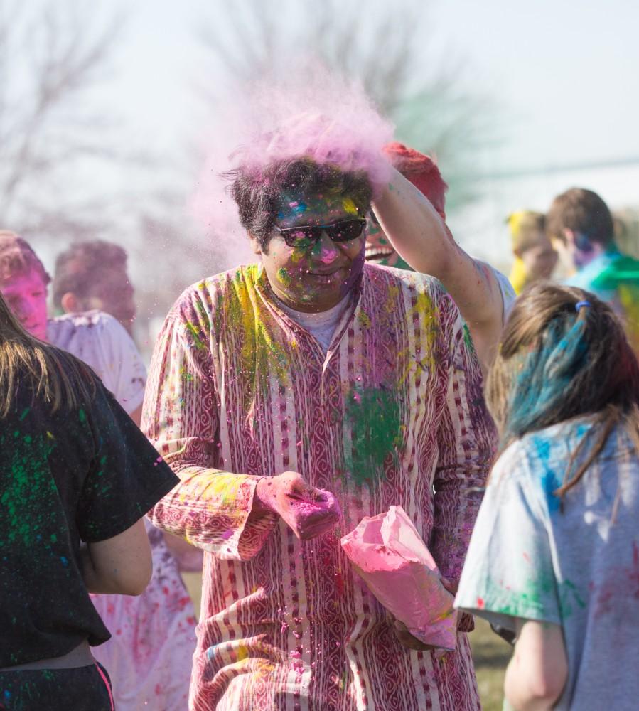 GVL / Kevin Sielaff - Assistant Professor Abhishek Ghosh participates in Holi. Grand Valley celebrates India’s spring color festival, Holi, for the first time on Friday, April 15, 2016.