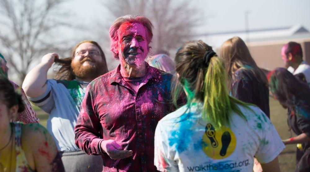 GVL / Kevin Sielaff - Assistant Professor of Liberal Studies Brent Smith participates in Holi. Grand Valley celebrates India’s spring color festival, Holi, for the first time on Friday, April 15, 2016.