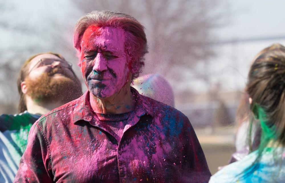 GVL / Kevin Sielaff - Assistant Professor of Liberal Studies Brent Smith participates in Holi. Grand Valley celebrates India’s spring color festival, Holi, for the first time on Friday, April 15, 2016.