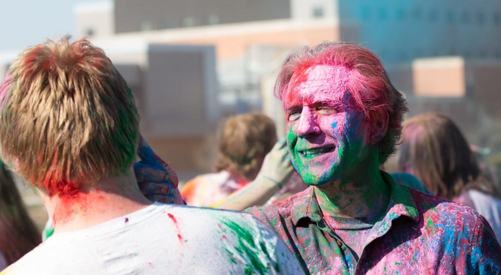 GVL / Kevin Sielaff - Assistant Professor of Liberal Studies Brent Smith participates in Holi. Grand Valley celebrates India’s spring color festival, Holi, for the first time on Friday, April 15, 2016.