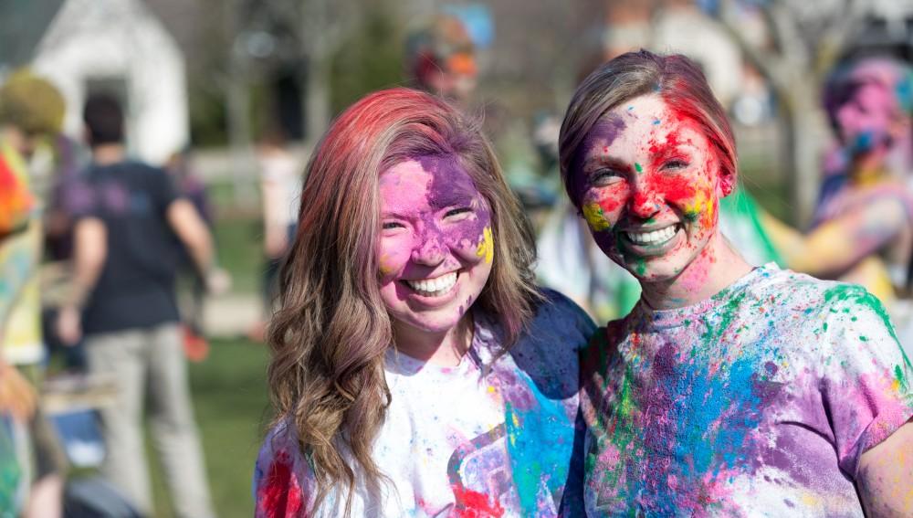 GVL / Kevin Sielaff - Bethany Garcia (left) and Francesca Golus (right) participate in Holi. Grand Valley celebrates India’s spring color festival, Holi, for the first time on Friday, April 15, 2016.