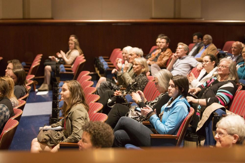 GVL / Sara Carte - The audience claps for Rev. Jennifer Bailey at the Kaufman Interfaith Institute: Sigal Lecture in the Pew Loosemore Auditorium on Wednesday, Mar. 30, 2016.