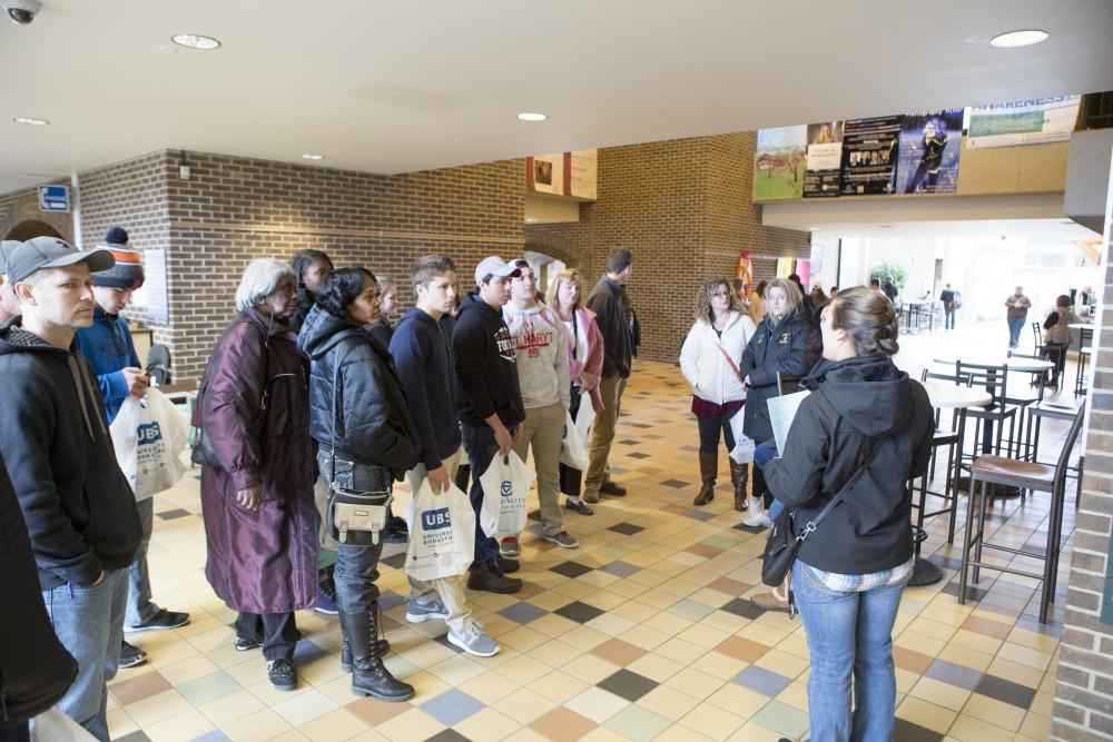 GVL / Sara Carte - Tour guide, Sam tonks, gives high school students a tour of Grand Valley for Laker Experience Day on Friday, Apr. 8, 2016.