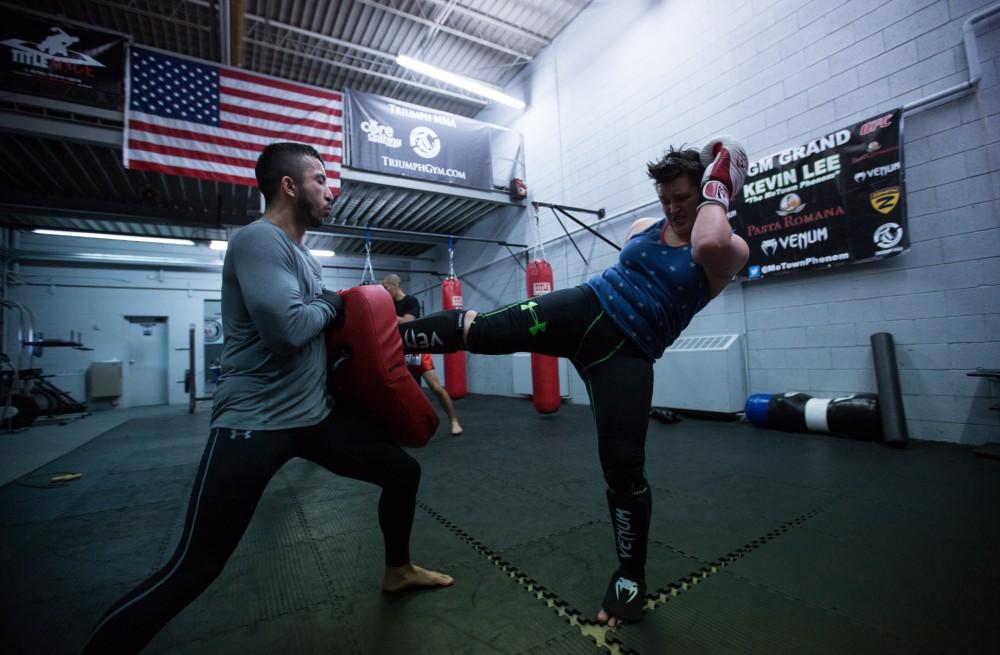 GVL / Kevin Sielaff - Nikita Netjes trains with Santoz Farias at Triumph MMA on Plainfield Ave. in Grand Rapids Tuesday, April 12, 2016.