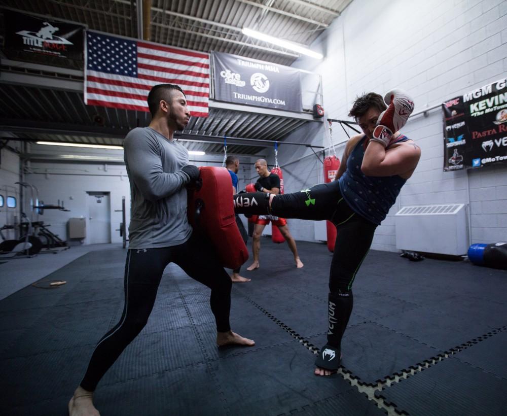 GVL / Kevin Sielaff - Nikita Netjes trains with Santoz Farias at Triumph MMA on Plainfield Ave. in Grand Rapids Tuesday, April 12, 2016.