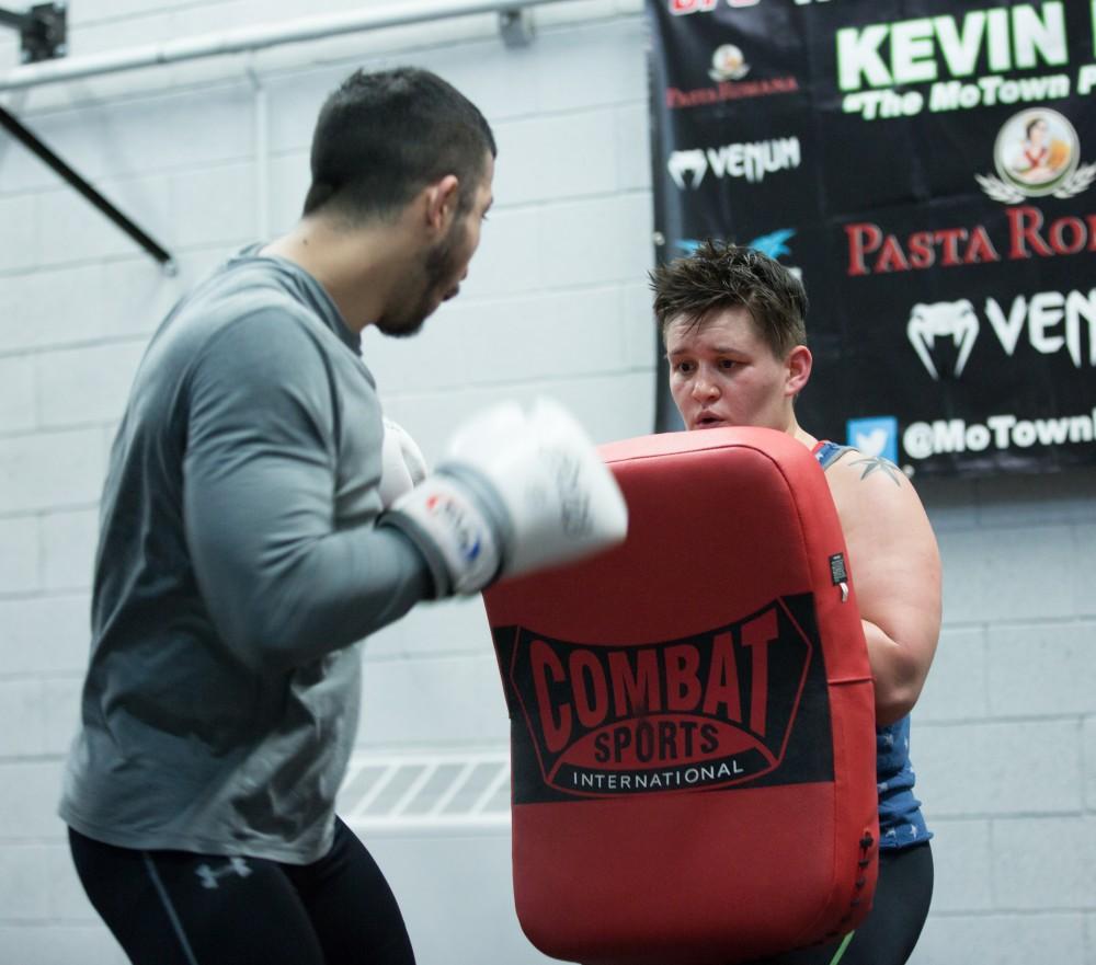 GVL / Kevin Sielaff - Nikita Netjes trains with Santoz Farias at Triumph MMA on Plainfield Ave. in Grand Rapids Tuesday, April 12, 2016.