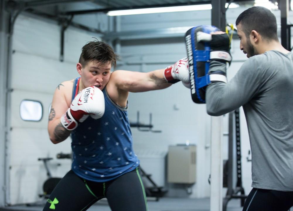 GVL / Kevin Sielaff - Nikita Netjes trains with Santoz Farias at Triumph MMA on Plainfield Ave. in Grand Rapids Tuesday, April 12, 2016.