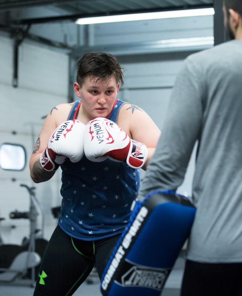 GVL / Kevin Sielaff - Nikita Netjes trains with Santoz Farias at Triumph MMA on Plainfield Ave. in Grand Rapids Tuesday, April 12, 2016.