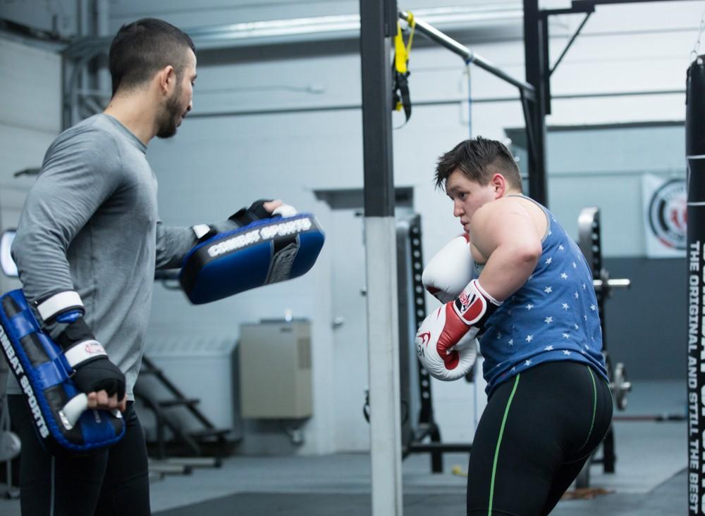 GVL / Kevin Sielaff - Nikita Netjes trains with Santoz Farias at Triumph MMA on Plainfield Ave. in Grand Rapids Tuesday, April 12, 2016.