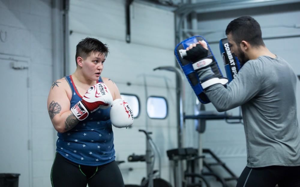 GVL / Kevin Sielaff - Nikita Netjes trains with Santoz Farias at Triumph MMA on Plainfield Ave. in Grand Rapids Tuesday, April 12, 2016.