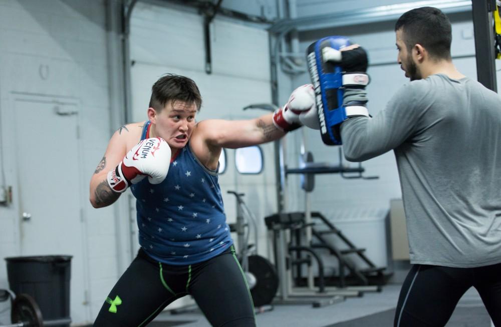 GVL / Kevin Sielaff - Nikita Netjes trains with Santoz Farias at Triumph MMA on Plainfield Ave. in Grand Rapids Tuesday, April 12, 2016.