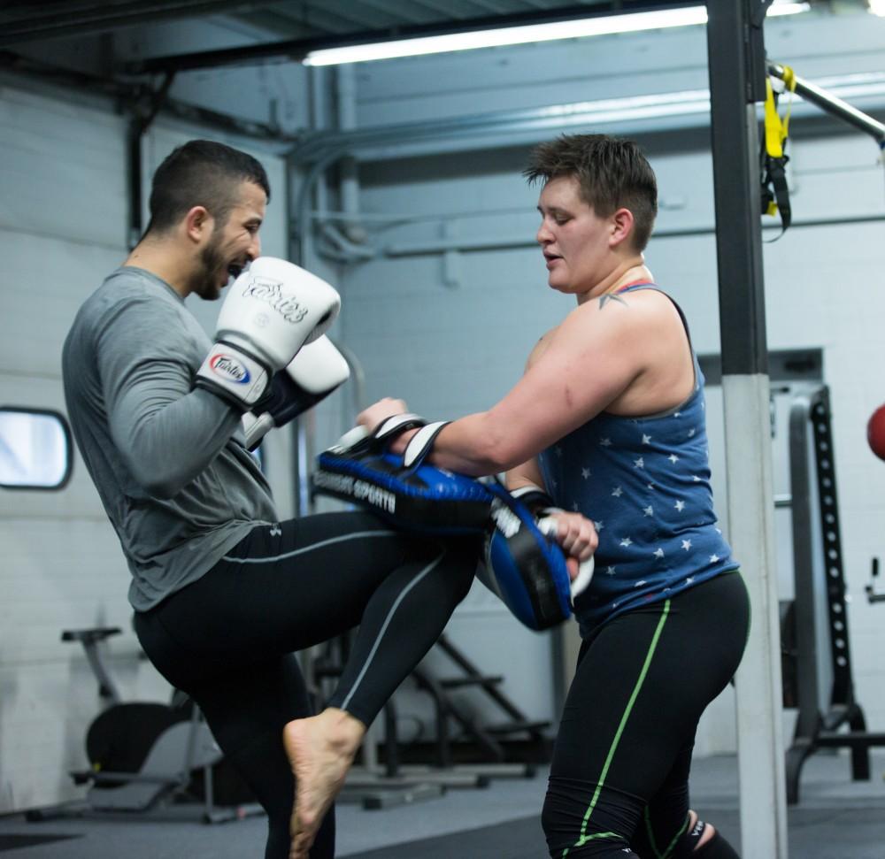 GVL / Kevin Sielaff - Nikita Netjes trains with Santoz Farias at Triumph MMA on Plainfield Ave. in Grand Rapids Tuesday, April 12, 2016.