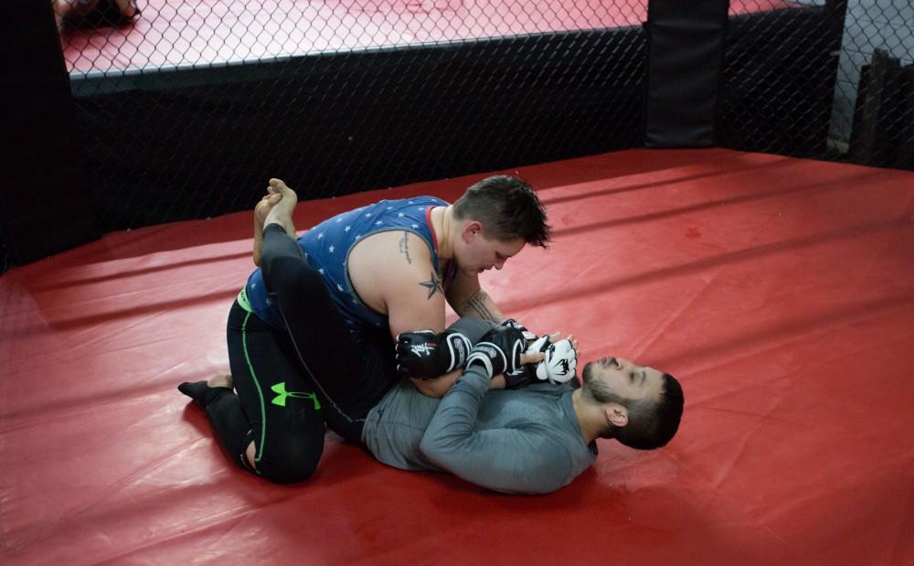 GVL / Kevin Sielaff - Nikita Netjes trains with Santoz Farias at Triumph MMA on Plainfield Ave. in Grand Rapids Tuesday, April 12, 2016.