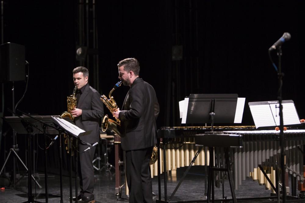 GVL / Sara Carte - Jonathan Nichol (left) and Geoffrey Deibel (right) perform at the GVSU New Music Ensemble 10th Anniversary Concert to begin at the Peter Martin Wege Theatre in Grand Rapids on Saturday, Apr. 2, 2016.