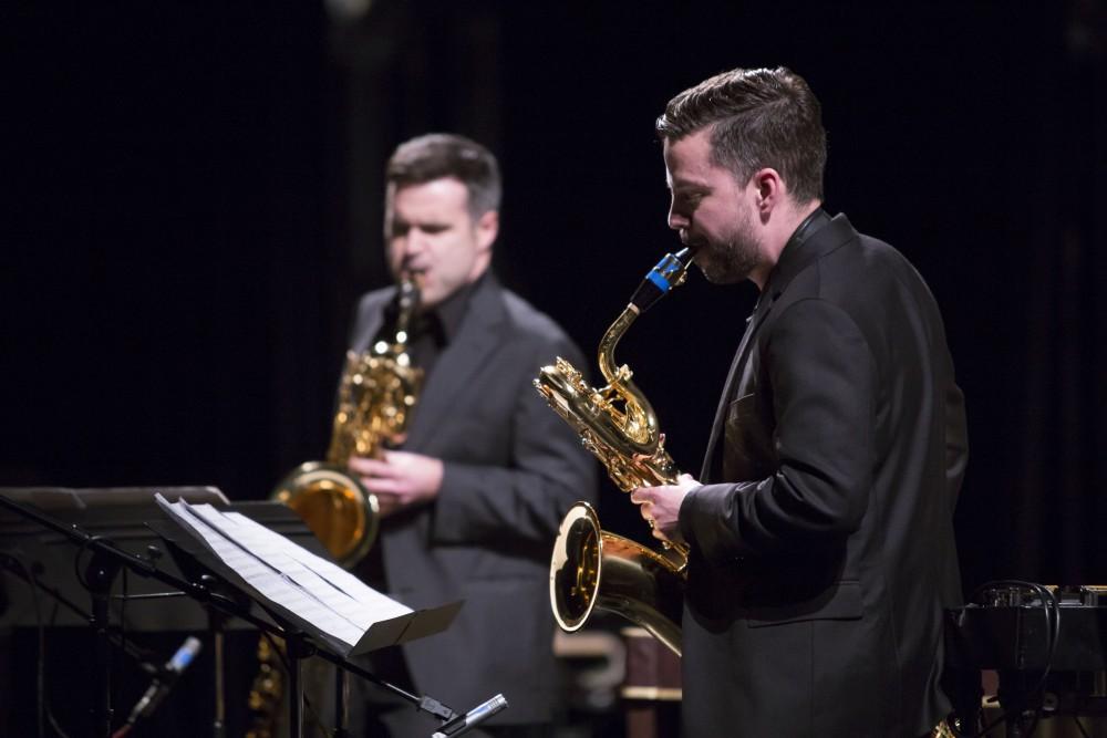 GVL / Sara Carte - Jonathan Nichol (left) and Geoffrey Deibel (right) perform at the GVSU New Music Ensemble 10th Anniversary Concert to begin at the Peter Martin Wege Theatre in Grand Rapids on Saturday, Apr. 2, 2016.